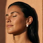 White teardrop pearl hoop earrings with gold-tone outer frame